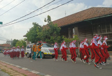 Semangat Membara Siswa SD dan SMP Ikuti Lomba Gerak Jalan Indah di Kayuagung